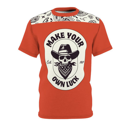 Orange t-shirt with skull, hat design and "MAKE YOUR OWN LUCK".