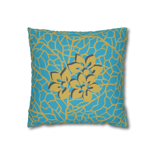 Decorative blue pillow with golden floral pattern on white background.