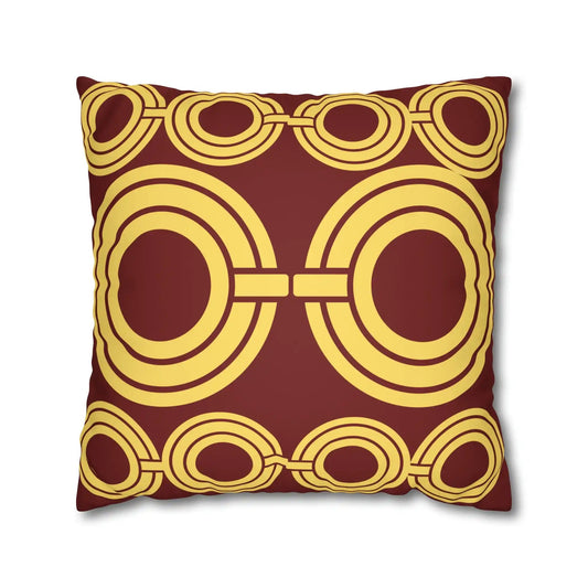 Decorative cushion with geometric circles pattern on a maroon background.
