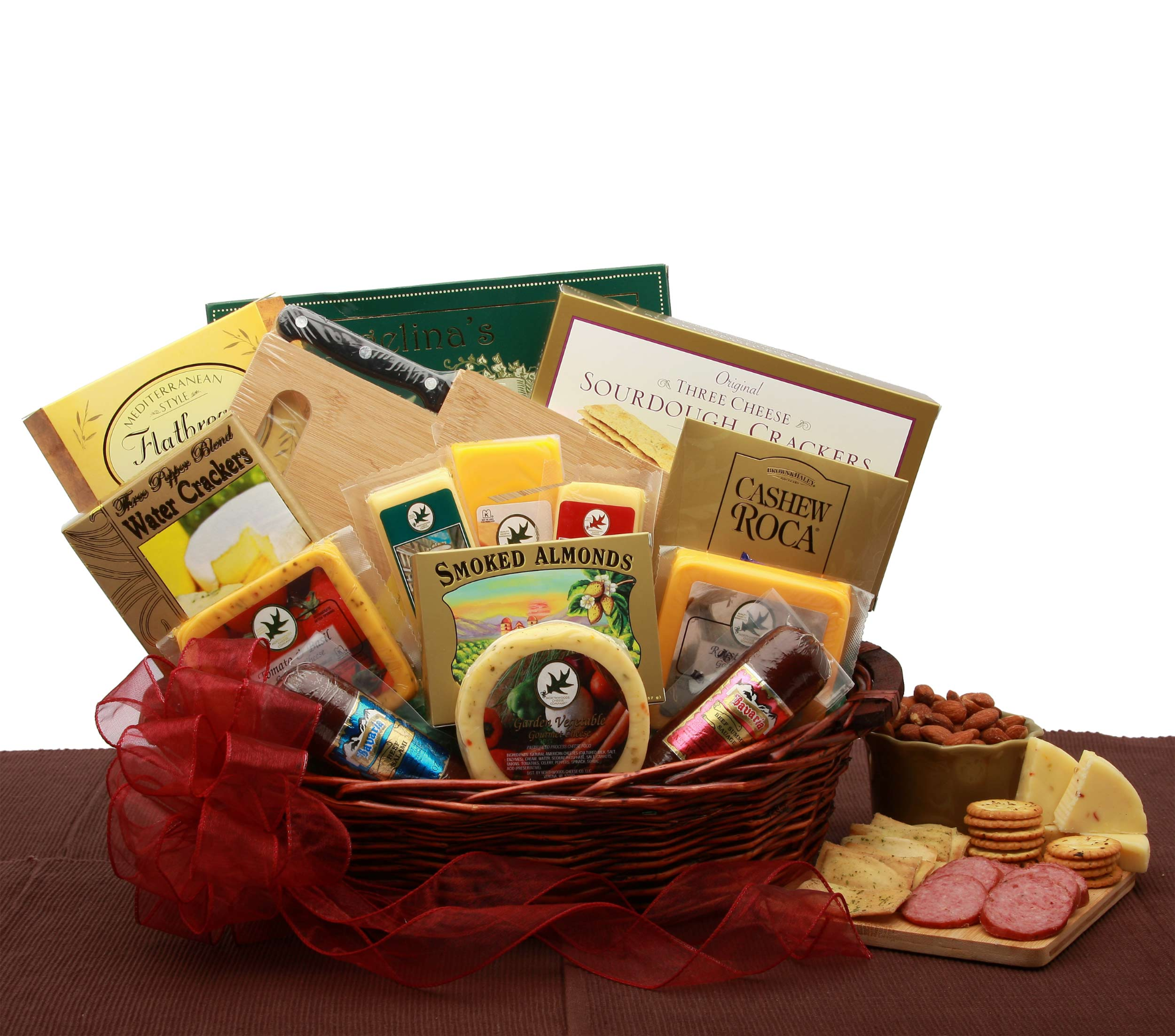 Gourmet food basket with cheese, crackers, almonds, and salami.