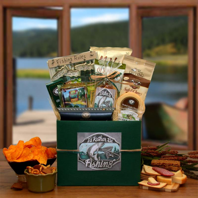 Gift basket with fishing theme, snacks, and lake in background.
