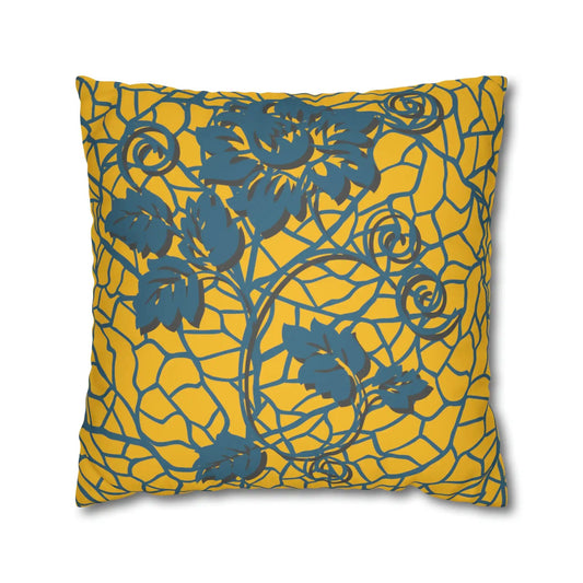 Decorative cushion with blue floral pattern on yellow background.
