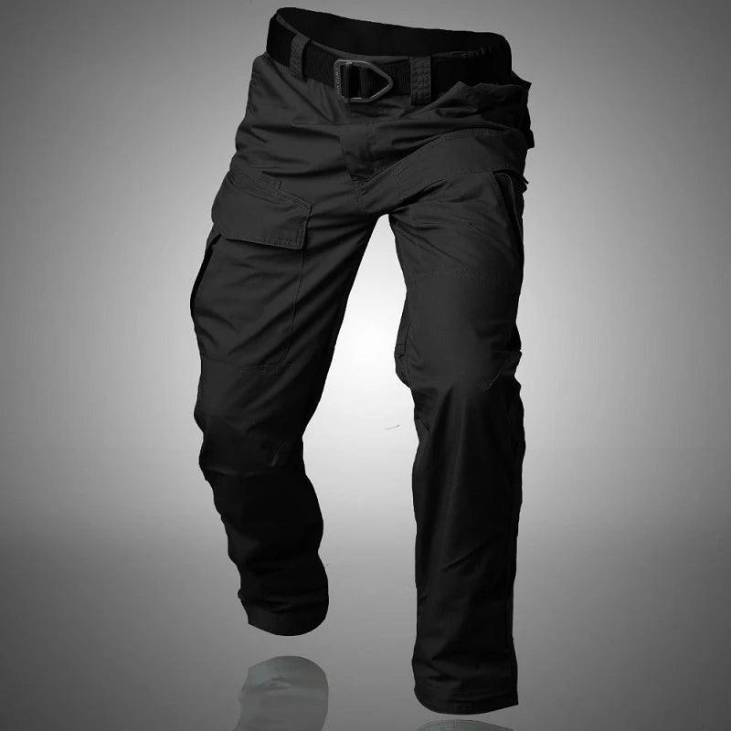 Black cargo pants with belt, floating appearance, reflective surface below.