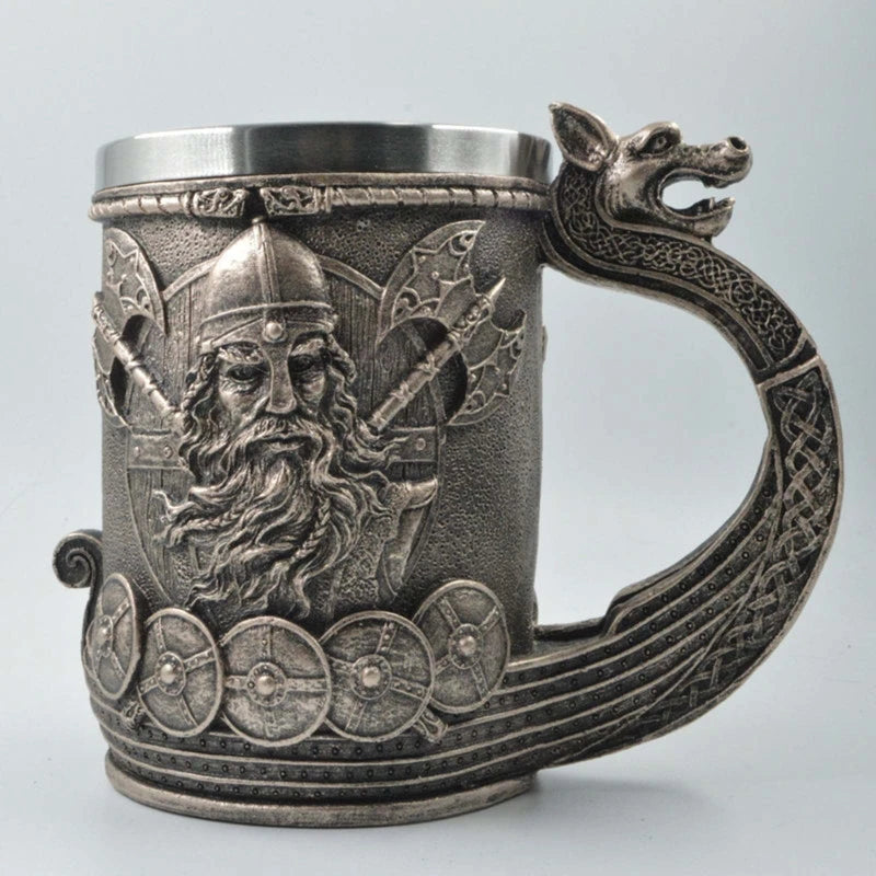Pewter Viking-themed mug with intricately designed handle and details.