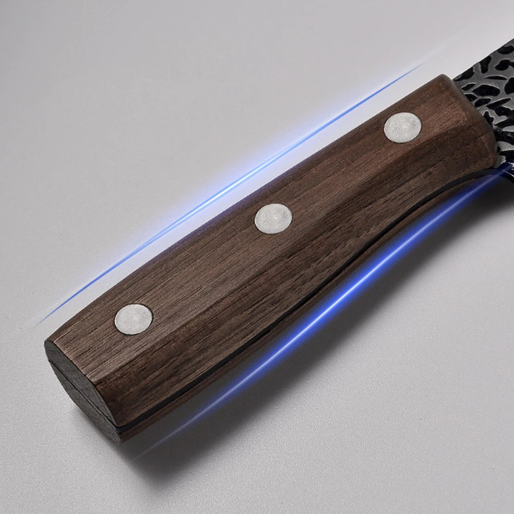 Close-up of a kitchen knife with a glowing blue edge.